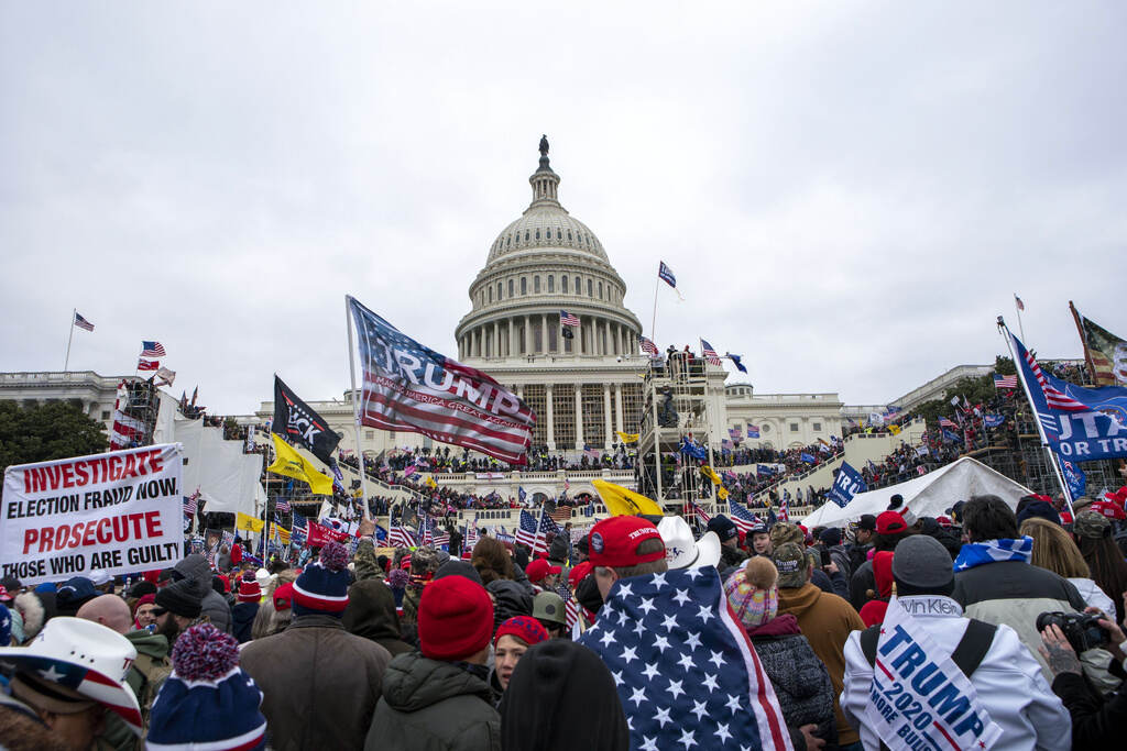 Obama Threat Arrest Rioters on Jan. 6, 2021 in front of the U.S. Capitol building.