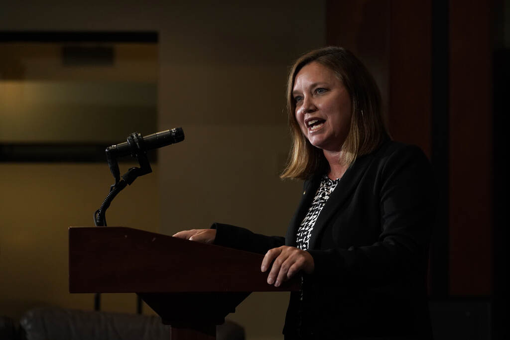 Jehovah’s Witnesses Abuse Investigation Pennsylvania Attorney General Michelle Henry speaks into a microphone at a podium.