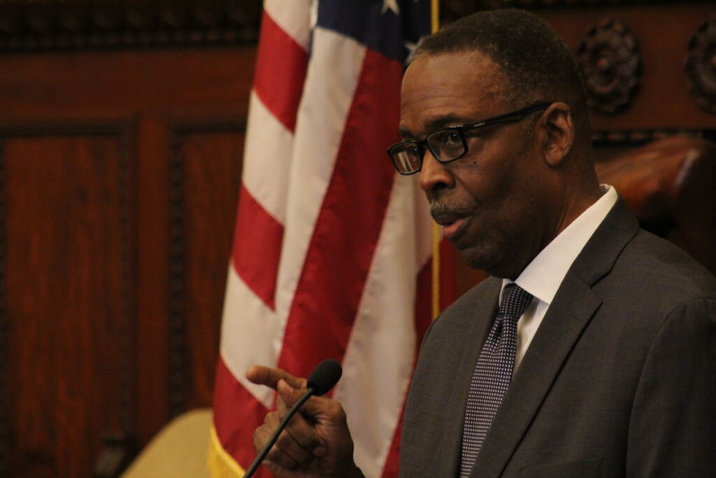 City Council President Darrell Clarke speaks into a microphone.