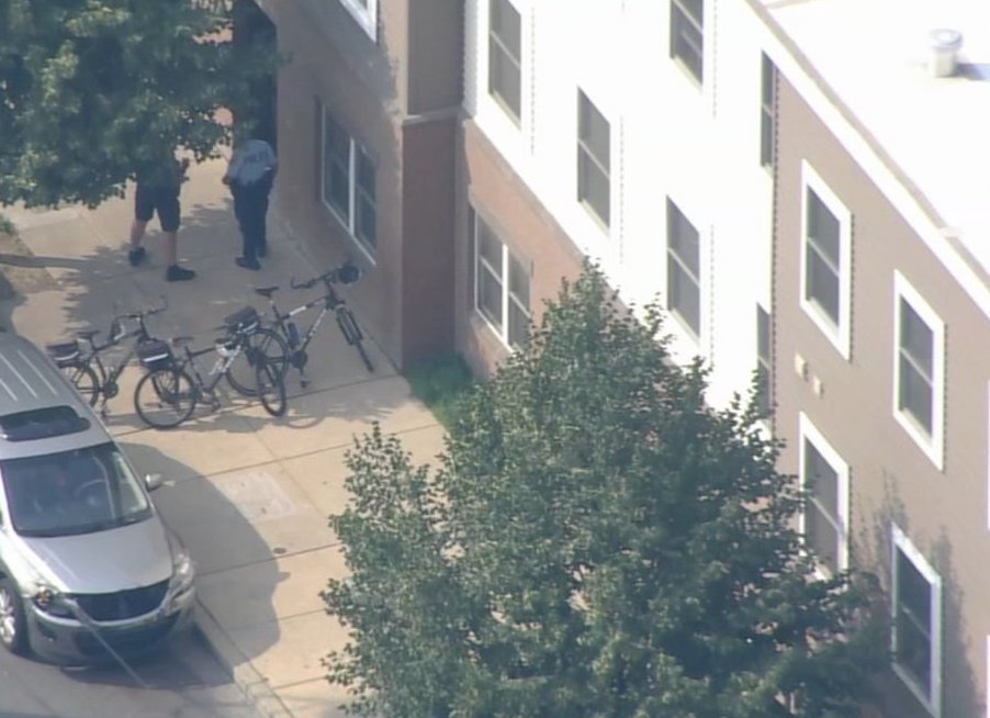 port-richmond-shooting An aerial view of houses and people on a sidewalk.