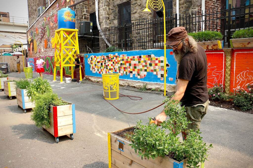 Jacob ‘’Chris’’ Hammes watering the garden