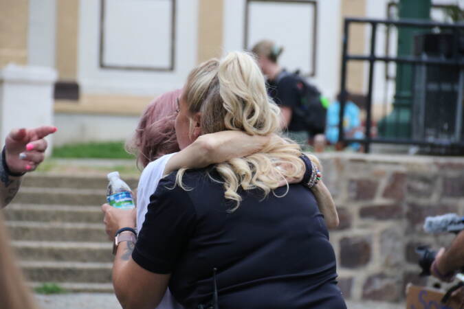 Community members embraced each other as the evening wrapped up