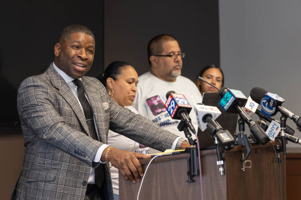 08 21 2023 k paynter eddie izzizarry family and attorneys-2 Philadelphia criminal attorney Shaka Johnson called into question information released by Philadelphia police about the shooting of 27-year-old Eddie Irizarry at a press conference with Irizarry’s family on Aug.22, 2023. (Kimberly Paynter/WHYY)