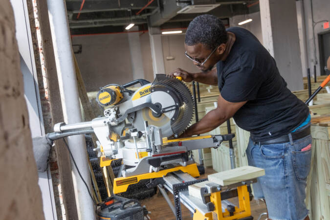 Oman Sewell operates a construction machine
