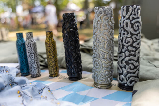 Artillery casings from the Russo-Ukrainian War repurposed into art by Max Kilderov were sold by the United Ukrainian American Relief Committee to support humanitarian efforts in Ukraine at the Ukrainian Folk Festival in Horsham, Pa., on August 27, 2023. (Kimberly Paynter/WHYY)
