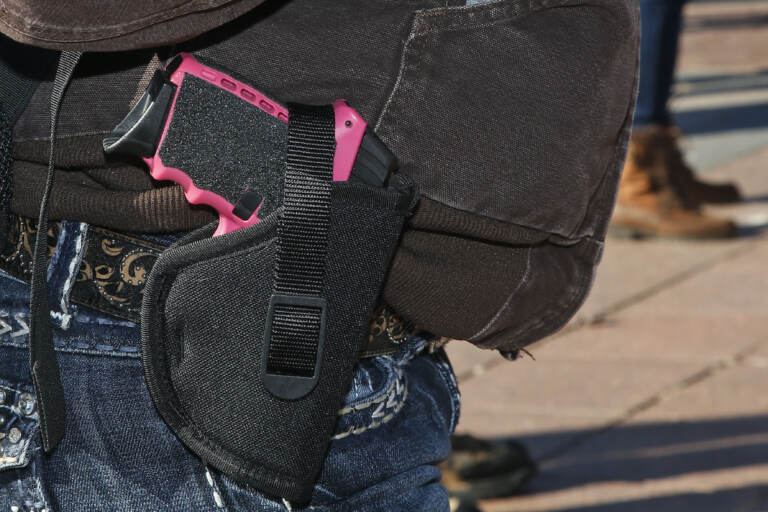 Gun advocates attend a rally at the state Capitol to mark the start of a new law that allows most adults in Oklahoma to carry a firearm in public without a background check or training, Friday, Nov. 1, 2019, in Oklahoma City