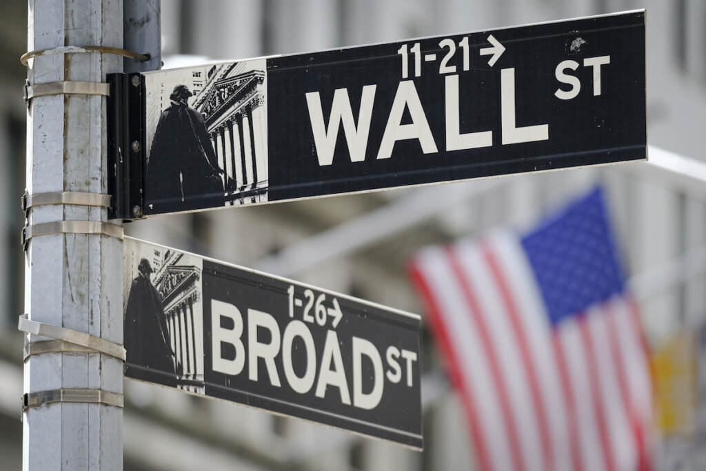New York Financial Markets A U.S. Flag hangs in the background at the corner of Wall and Broad Streets in the heart of the Financial District in New York City, Tuesday, Aug. 1, 2023.
