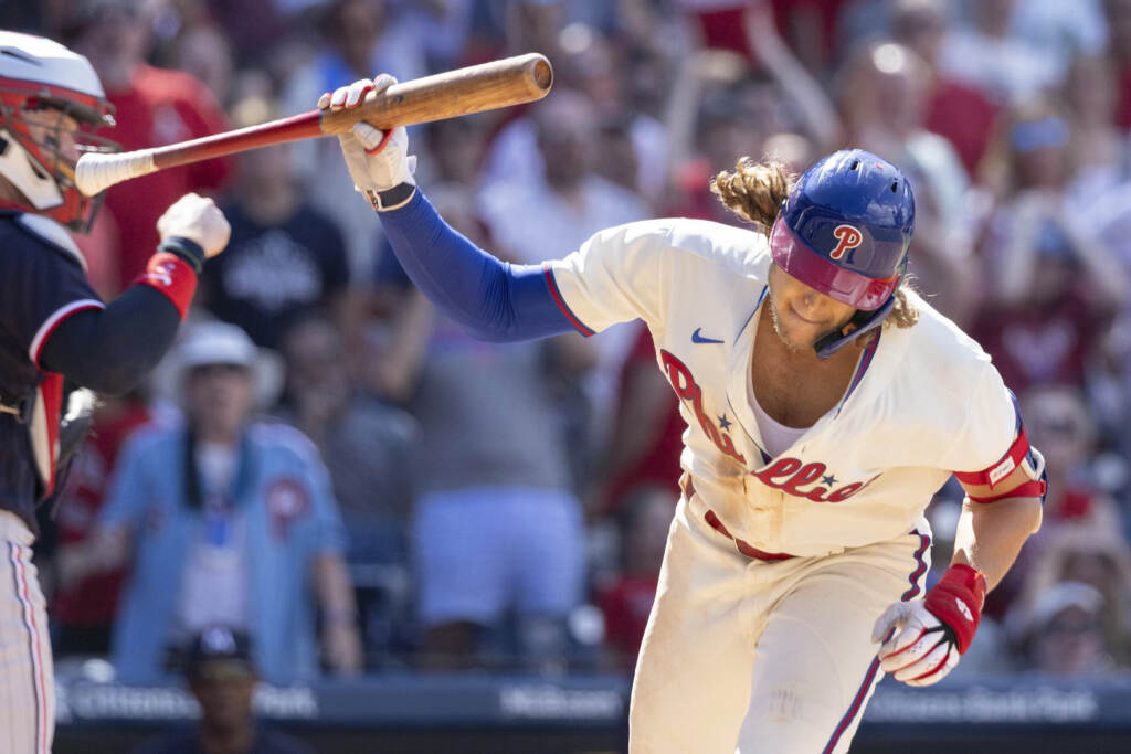 Philadelphia Phillies' Alec Bohm throws his bat after striking out with the bases loaded during the seventh inning of a baseball game against the Minnesota Twins, Sunday, Aug. 13, 2023, in Philadelphia. (AP Photo/Laurence Kesterson)