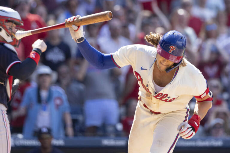 Philadelphia Phillies' Alec Bohm throws his bat after striking out with the bases loaded during the seventh inning of a baseball game against the Minnesota Twins, Sunday, Aug. 13, 2023, in Philadelphia. (AP Photo/Laurence Kesterson)