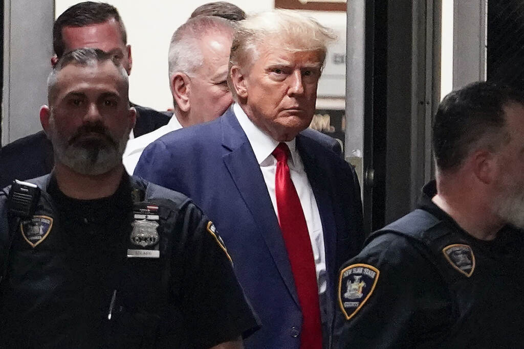 Donald Trump File photo: Former President Donald Trump is escorted to a courtroom, April 4, 2023, in New York.