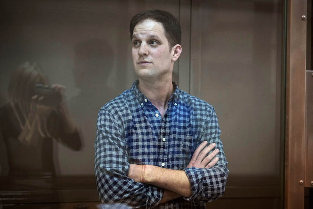 Russia US Journalist File photo: Wall Street Journal reporter Evan Gershkovich stands in a glass cage in a courtroom at the Moscow City Court, in Moscow, Russia, April 18, 2023.