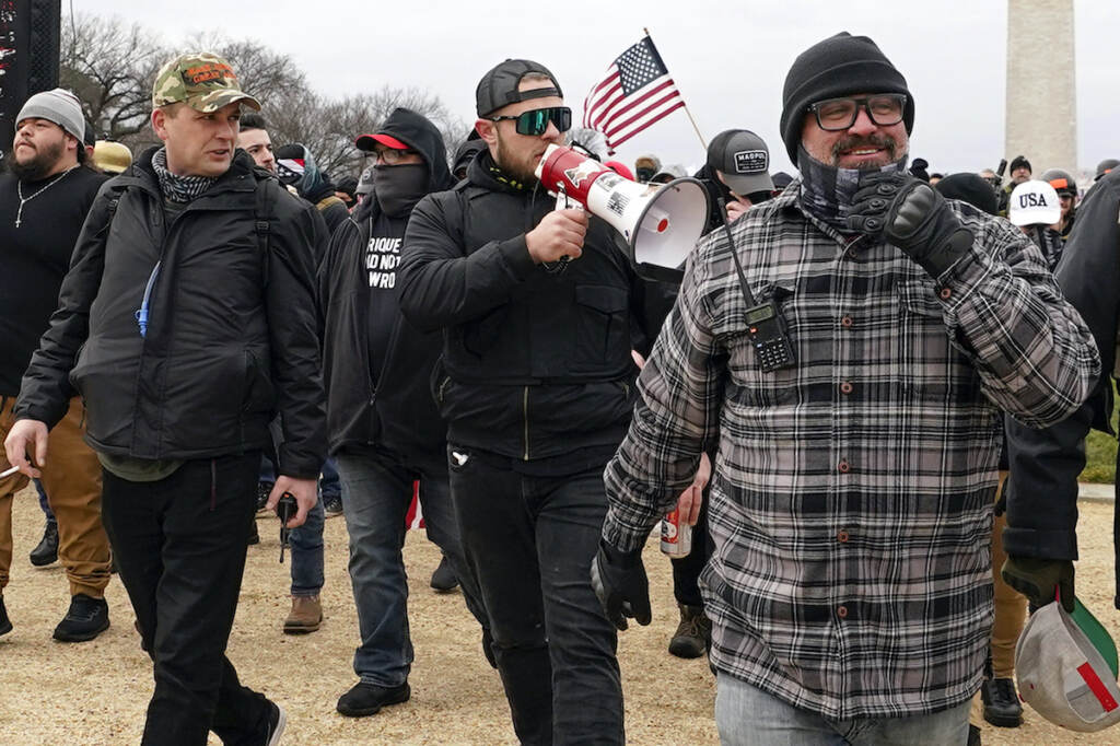 Capitol Riot Pround Boys File photo: Proud Boys members including Zachary Rehl (left) Ethan Nordean (center) and Joseph Biggs, walk toward the U.S. Capitol in Washington, in support of President Donald Trump on Jan. 6, 2021
