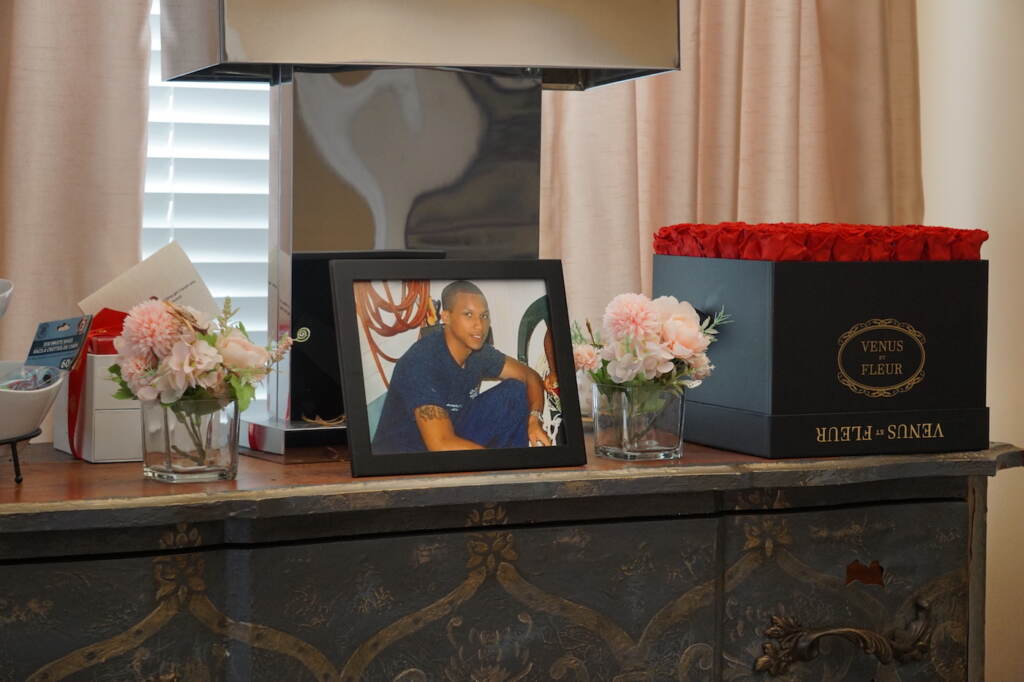 Photo of Kristian Hamilton-Arthur sitting on a dresser