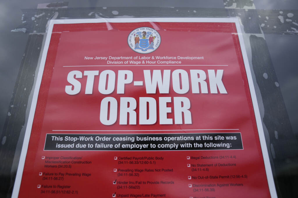 Boston Market Restaurants Closed Stop work order sign hanging on a door