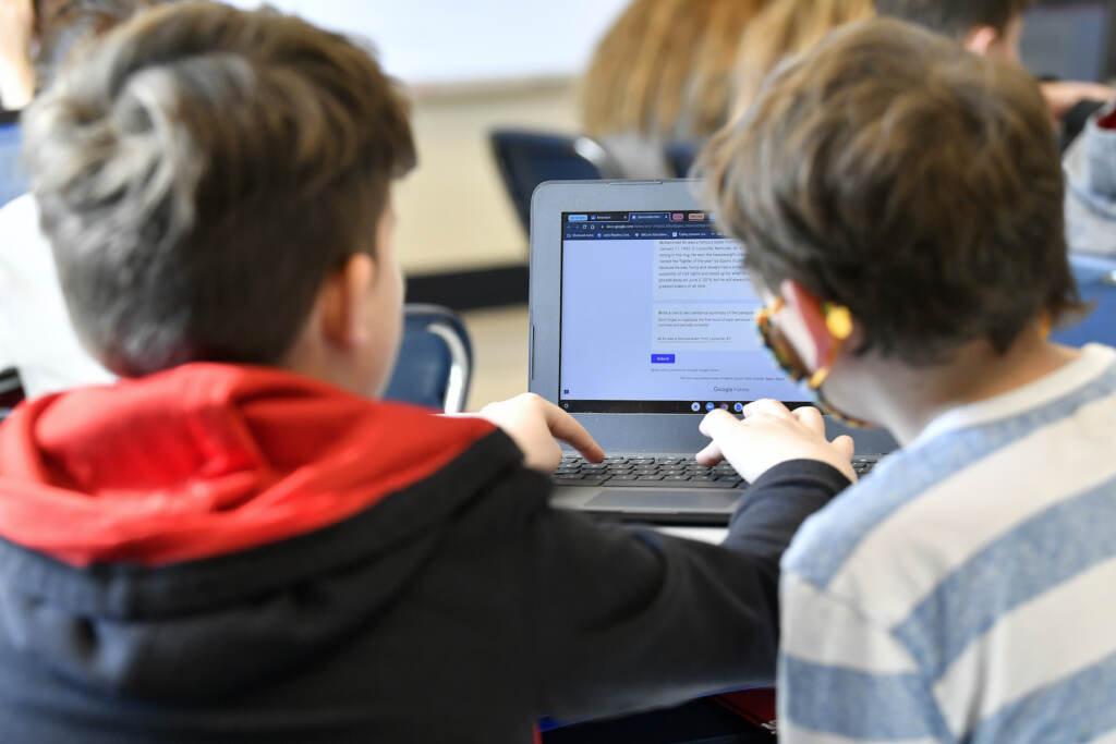 Michael Burton-Straub, Declan Lewis Students working on a computer together in a classroom