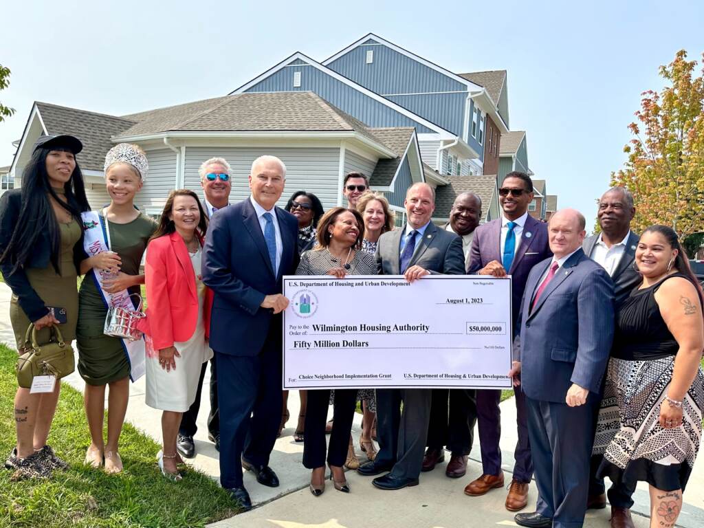 Community members and government leaders receiving the $50 million grant from the U.S. Development of Housing and Urban Development.