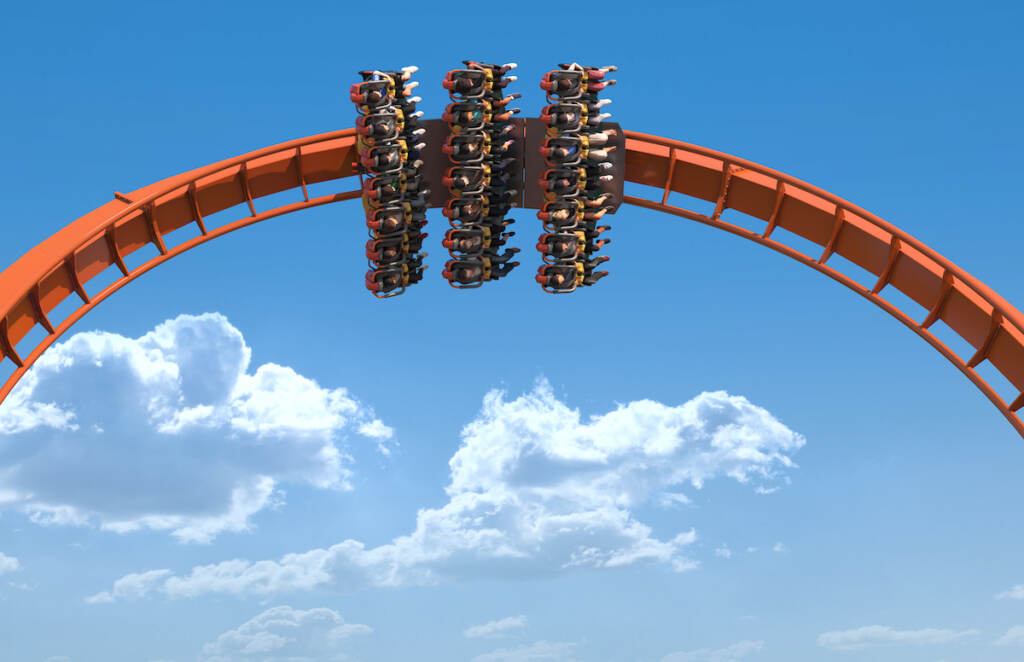 Iron Menace IMAGE 9 roller coaster at an amusement park.