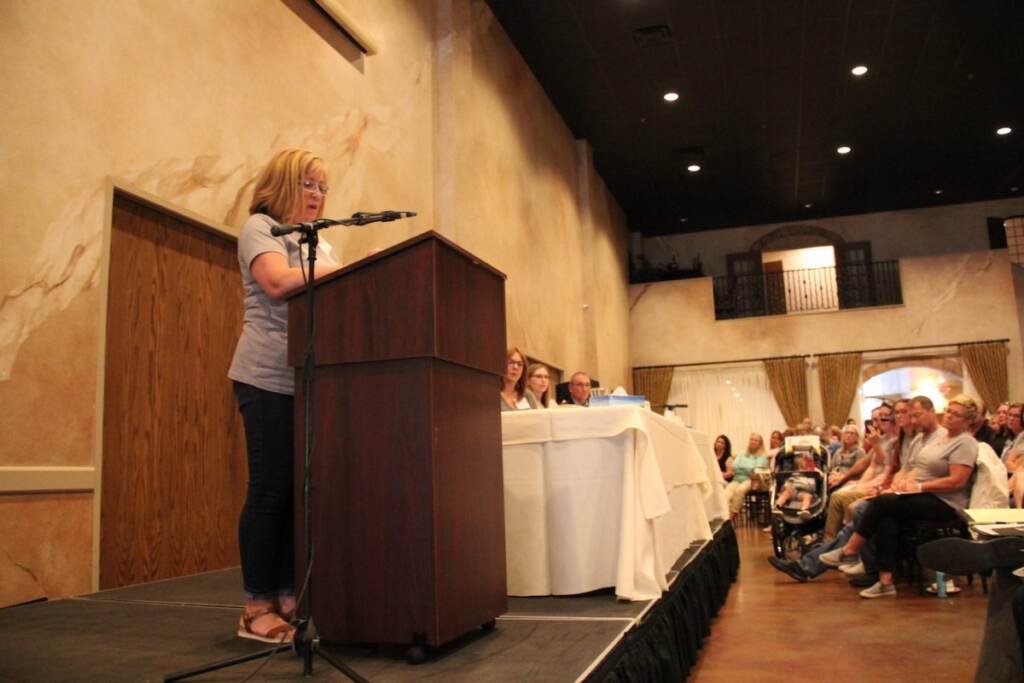 Janice Blanock speaks to a crowd at a meeting about cancer Janice Blanock