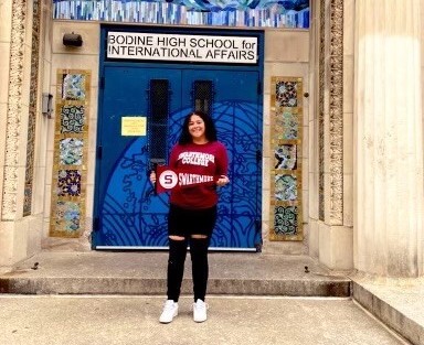 Kyyia Ford posing in front of her school.