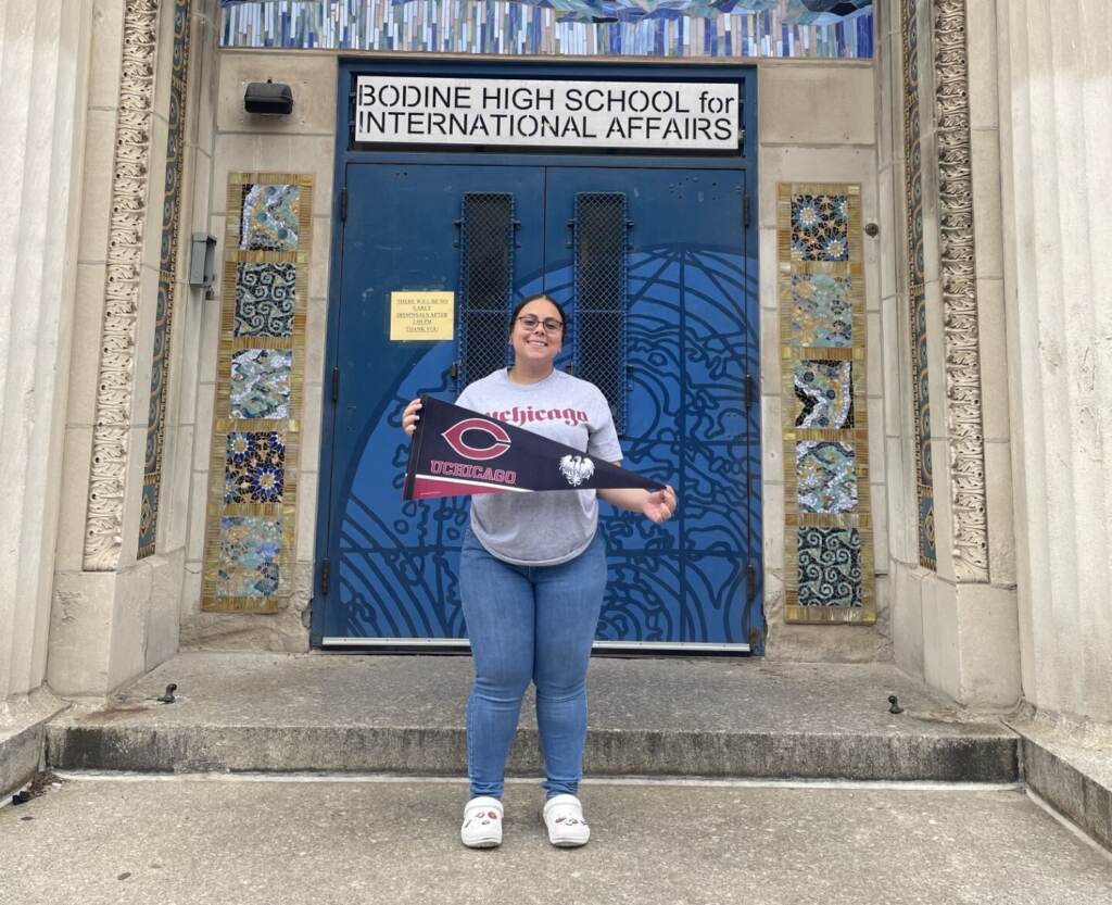 Liani Castro-Torres posing in front of her school