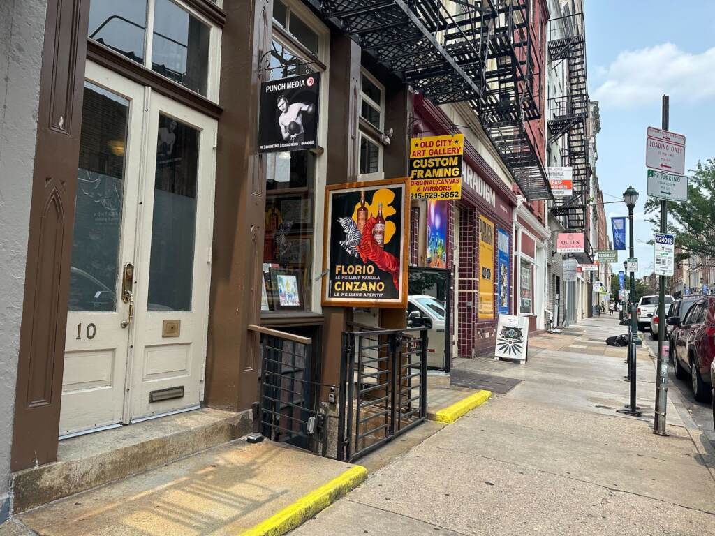 Shop windows on a busy commercial corridor.