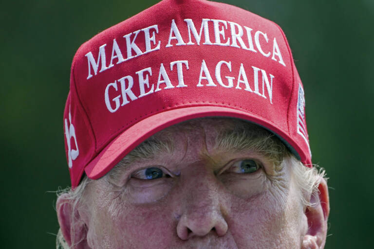 Trump wearing a MAGA hat