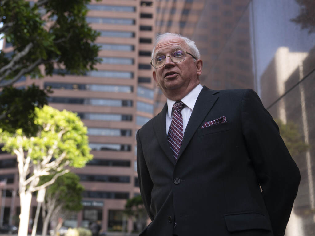 Attorney John Eastman is seen talking to reporters
