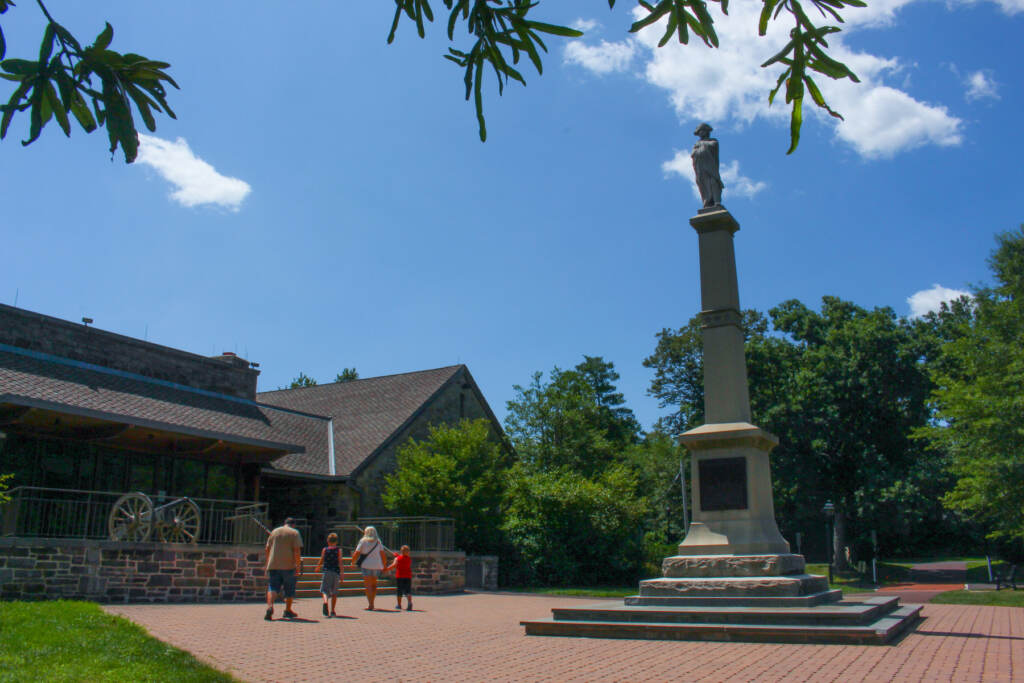 People walking into Washington Crossing Historic Park Visitor Center, the start of the driving route.