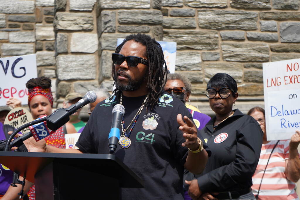 Chester resident Bigga Dre speaks at a podium