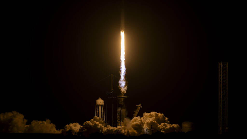 SpaceX Crew-7 Launch To Bring Astronauts To International Space Station A SpaceX Falcon 9 rocket lifts off in the dark.