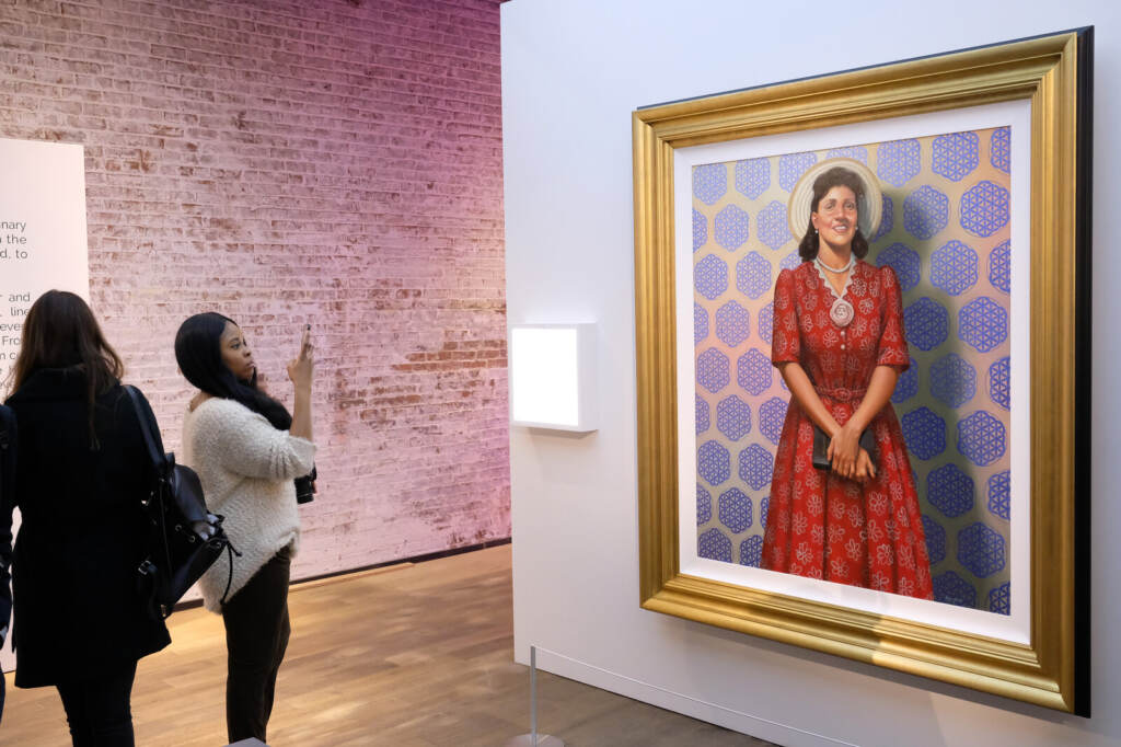 HBO’s The HeLa Project Exhibit For “The Immortal Life of Henrietta Lacks” Attendees gaze at a painting of Henrietta Lacks by Kadir Nelson at HBO's The HeLa Project Exhibit for The Immortal Life of Henrietta Lacks in 2017 in New York City. Nicholas Hunt/Getty Images for HBO