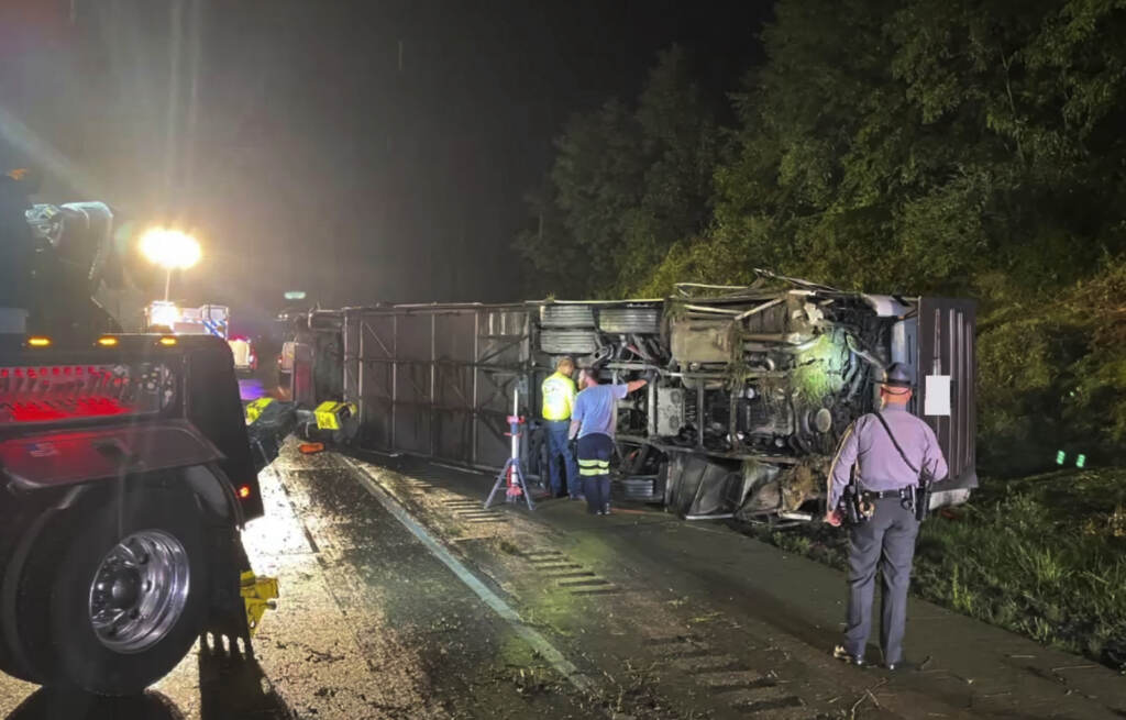 Bus Crash Pennsylvania Police and rescue workers arrive on the scene of a bus crash