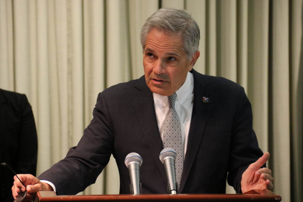 krasner-street-racing DA Krasner speaks at a podium.