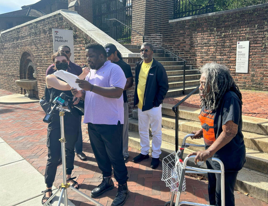 muhammad-pennmuseum-moveremainsdemand-2 Writer and activist Abdul-Aliy A. Muhammad speaks at a press conference in front of Penn Museum on Thursday. Also present are City Council at-large candidate Nicolas O'Rourke, Mike Africa Jr., and Ramona Africa