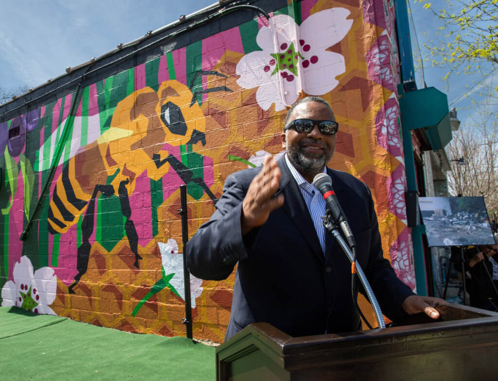 overbrookenvironmentalcenter-jeromeshabazz-mural Overbrook Environmental Education Center cofounder Jerome Shabazz at a 2022 Earth Day unveiling of a new Mural Arts mural at the West Philly center. (Overbrook Environmental Education Center/Facebook)