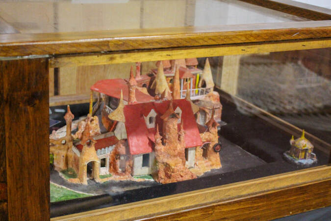 A miniature model of the Palace of Depression in a glass display case.