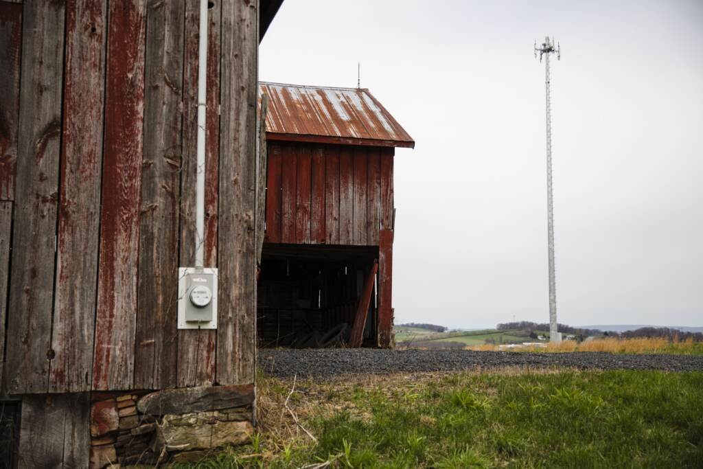 rural-pa-broadband-spotlight-pa-2023-08-25 A rural building with a cell tower in the background.