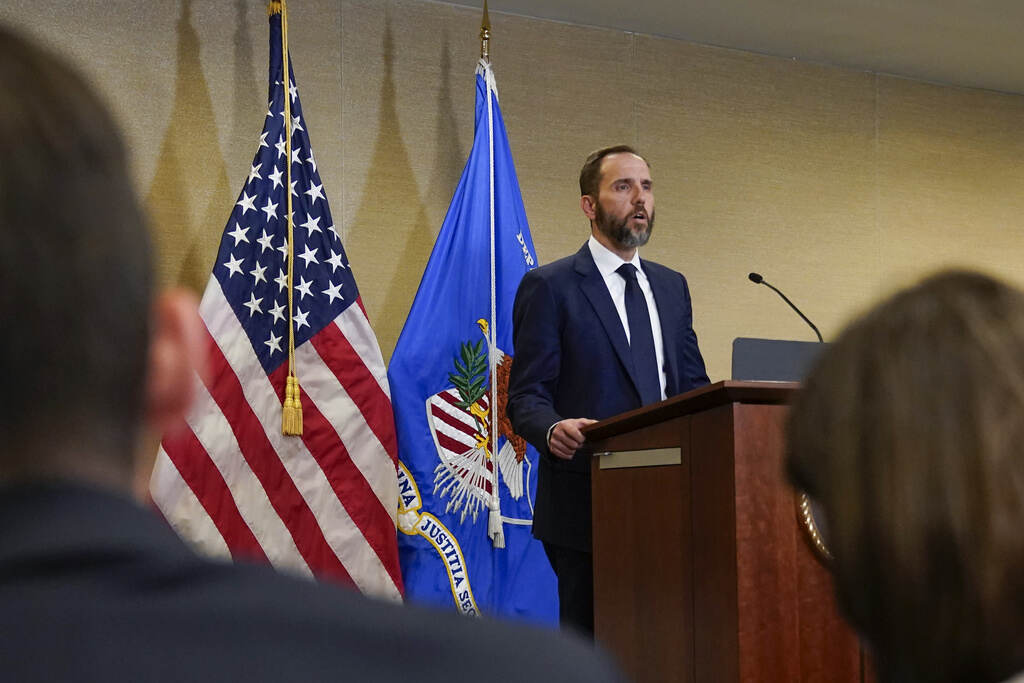 Special counsel Jack Smith speaks at a podium