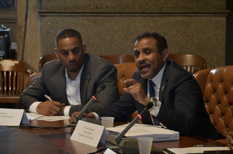 Tony Watlington speaking into a micrphone