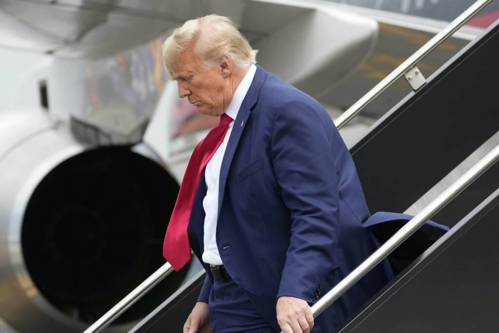 Donald Trump Donald Trump stepping off of an airplane.