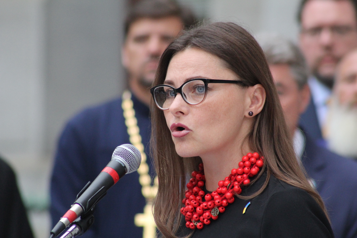 Iryna Mazur speaks into a microphone