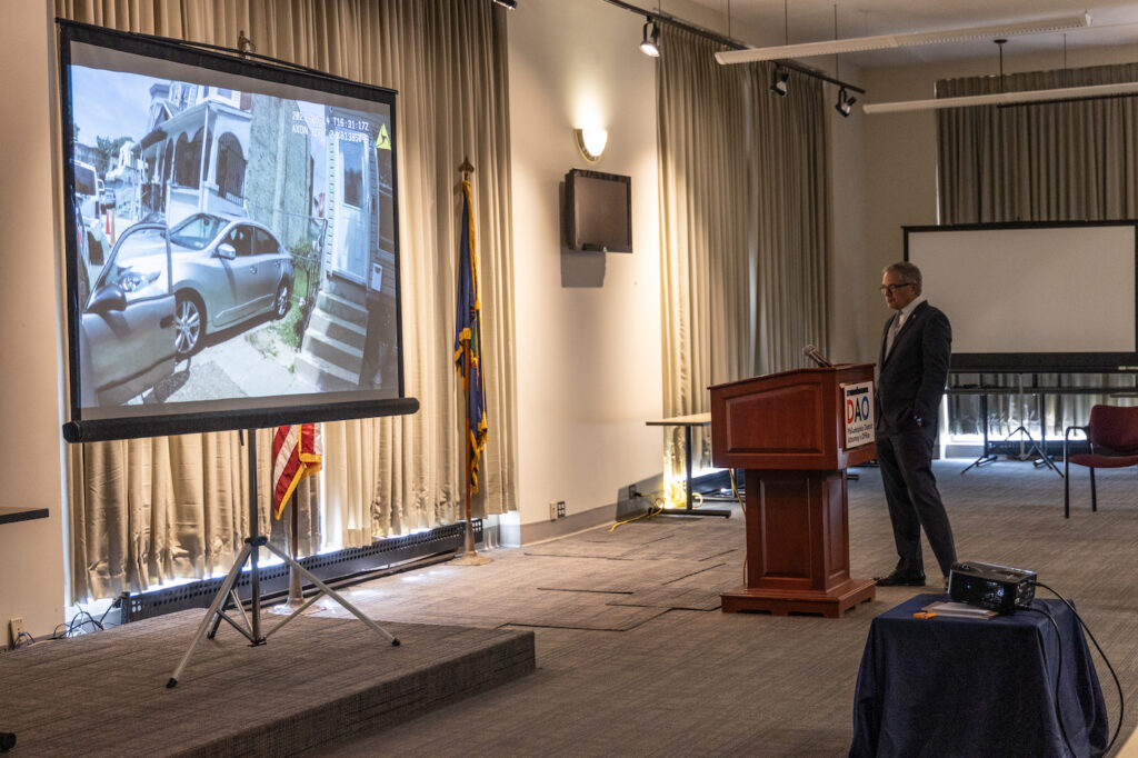 09 08 2023 k paynter dial charges presser-3 Philadelphia District Attorney Larry Krasner watches the body camera footage of former officer Mark Dial’s partner at a press conference announcing murder and other charges against Dial in the shooting and killing of 27-year-old Eddie Irizarry on September 8, 2023. (Kimberly Paynter/WHYY)
