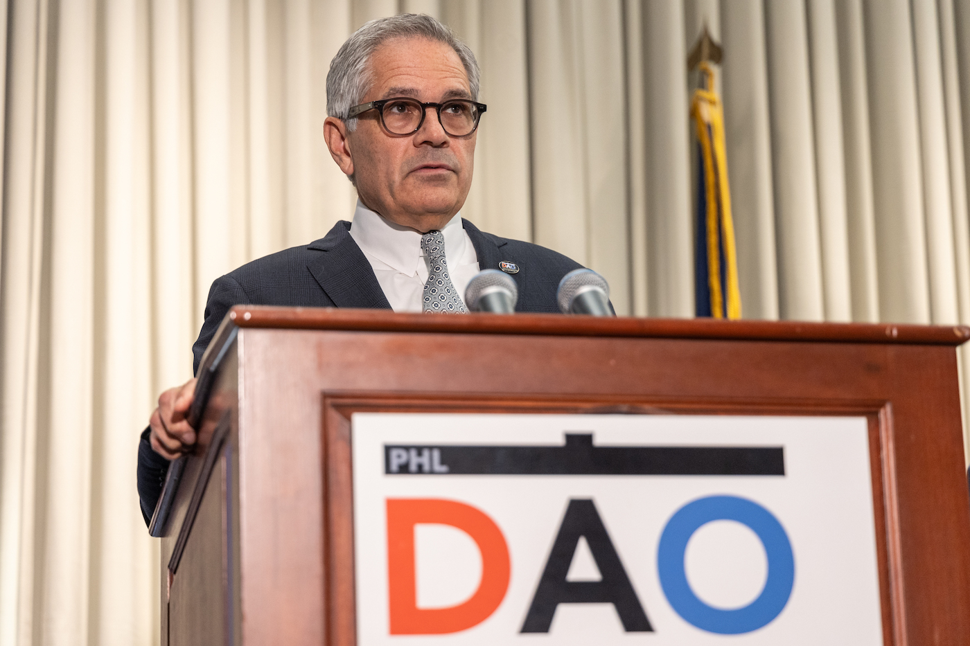 09 08 2023 k paynter dial charges presser-6 Larry Krasner speaking at a podium