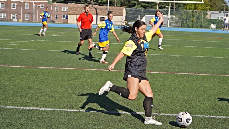 A player for the German Unity Cup women's team lines up to kick the ball against Brazil