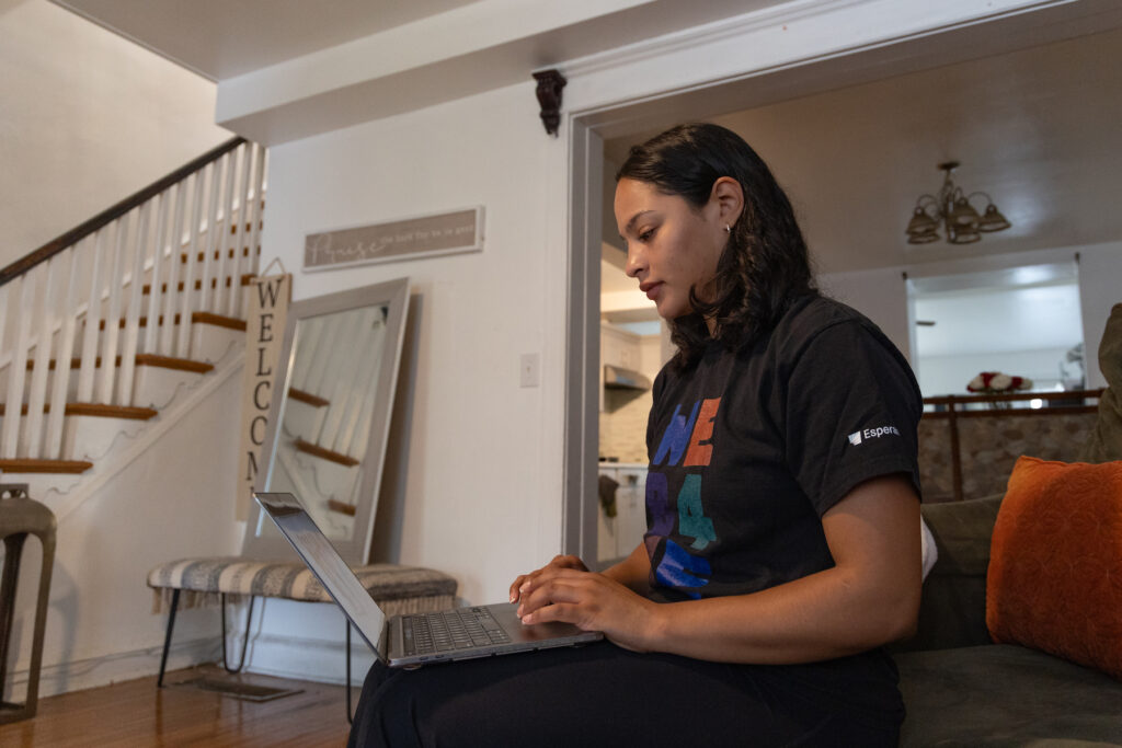 Nilda Diaz working on her laptop