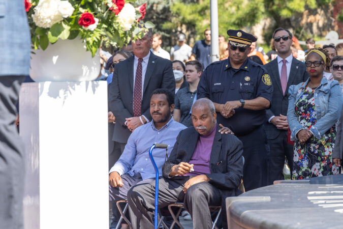 Jay Epps, bottom right, wipes tears from his eyes.