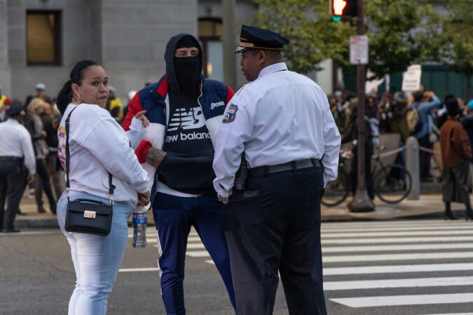 Interim Philadelphia Police Commissioner John Stanford (right) talked to family members of Eddie Irizarry Jr. during a protest