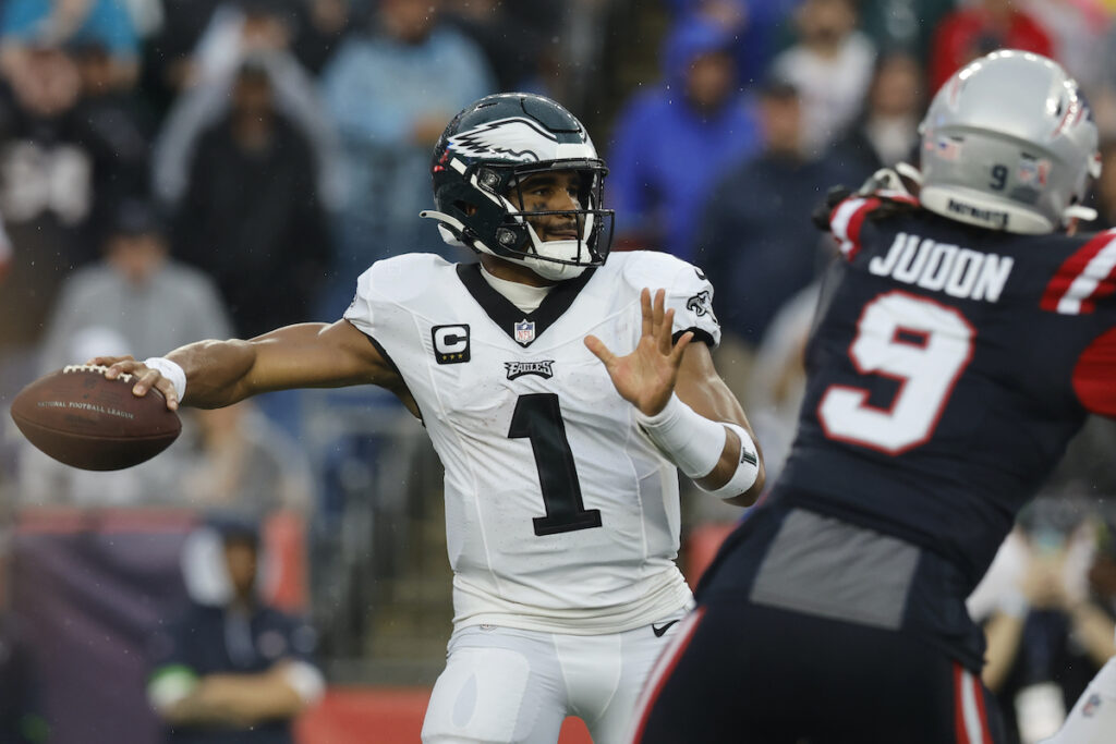 Eagles Patriots Football Philadelphia Eagles quarterback Jalen Hurts (1) looks for an opening while under pressure from New England Patriots linebacker Matthew Judon (9) in the first half of an NFL football game, Sunday, Sept. 10, 2023, in Foxborough, Mass