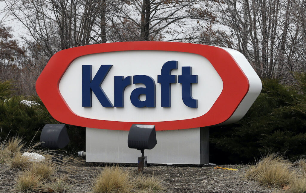 This March 25, 2015, file photo shows the Kraft logo outside of the company's headquarters in Northfield, Ill. Kraft Heinz is recalling individually-wrapped Kraft Singles American processed cheese slices because part of the wrapper could stick to the slice and become a choking hazard