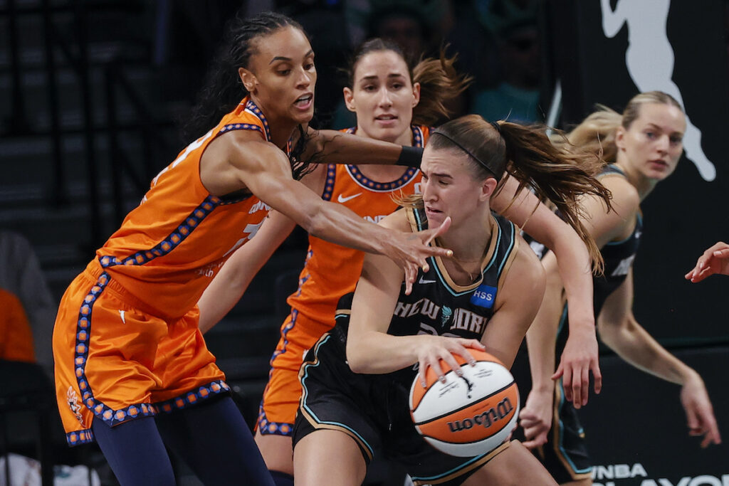 Sun Liberty Basketball New York Liberty guard Sabrina Ionescu, front right,is defended by Connecticut Sun forward DeWanna Bonner, left, during the second quarter of a WNBA basketball game, Sunday, Sept 24, 2023, in New York. (AP Photo/Eduardo Munoz Alvarez)